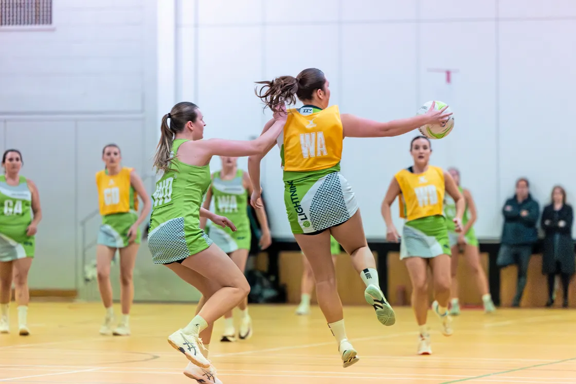 Bryony de Garis collects the ball marked by Nat Le Page