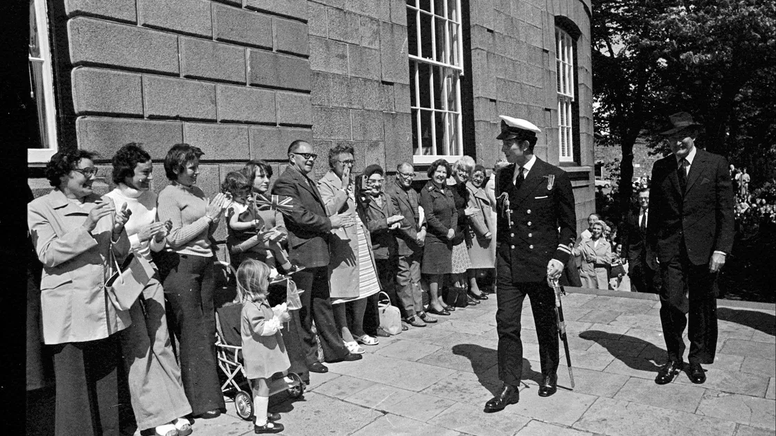 The prince was greeted by a small crowd as he arrived at the Royal Court.