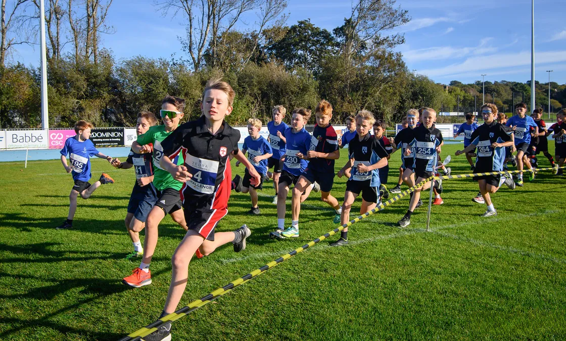 Years 7 and 8 boys round a corner on Footes Lane’s main pitch.