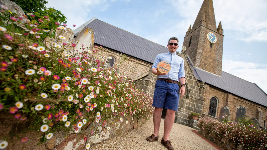 The rector of St Martin’s, the Rev. Daniel Foot, with its Eco Church bronze award. The aim to is to achieve the award’s gold standard. (Picture by Luke Le Prevost, 32216900)