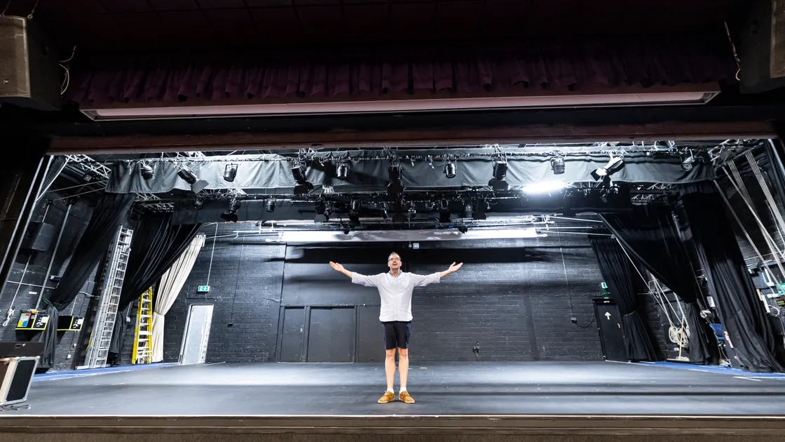 Evoke director Chris Bougourd pictured on stage at Beau Sejour with above him, the light structure that is forcing its temporary closure. 			 (34639246)