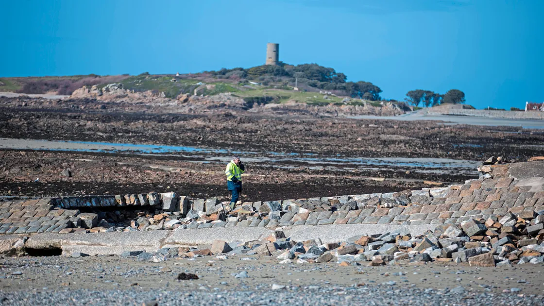 Part of the slipway on Route Du Port, Rocquaine has collapsed. An engineer from States Property Services assesses the damage. (24103296)