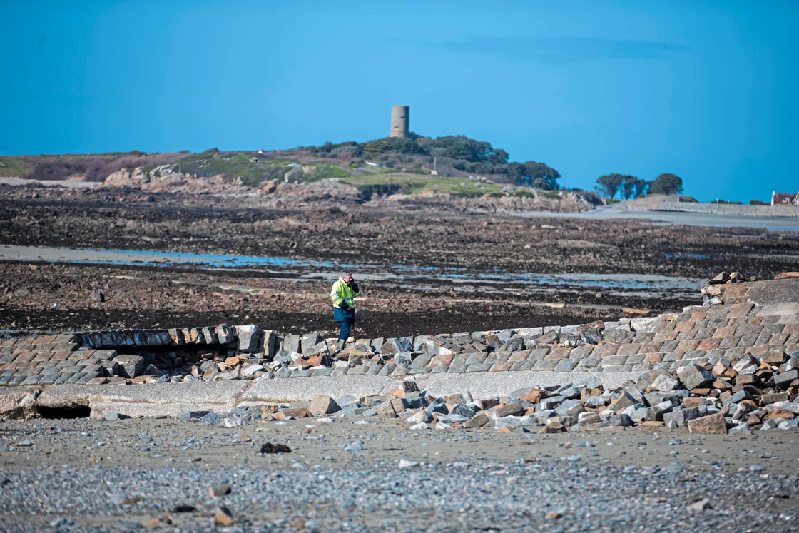 Part of the slipway on Route Du Port, Rocquaine has collapsed. An engineer from States Property Services assesses the damage. (24103296)