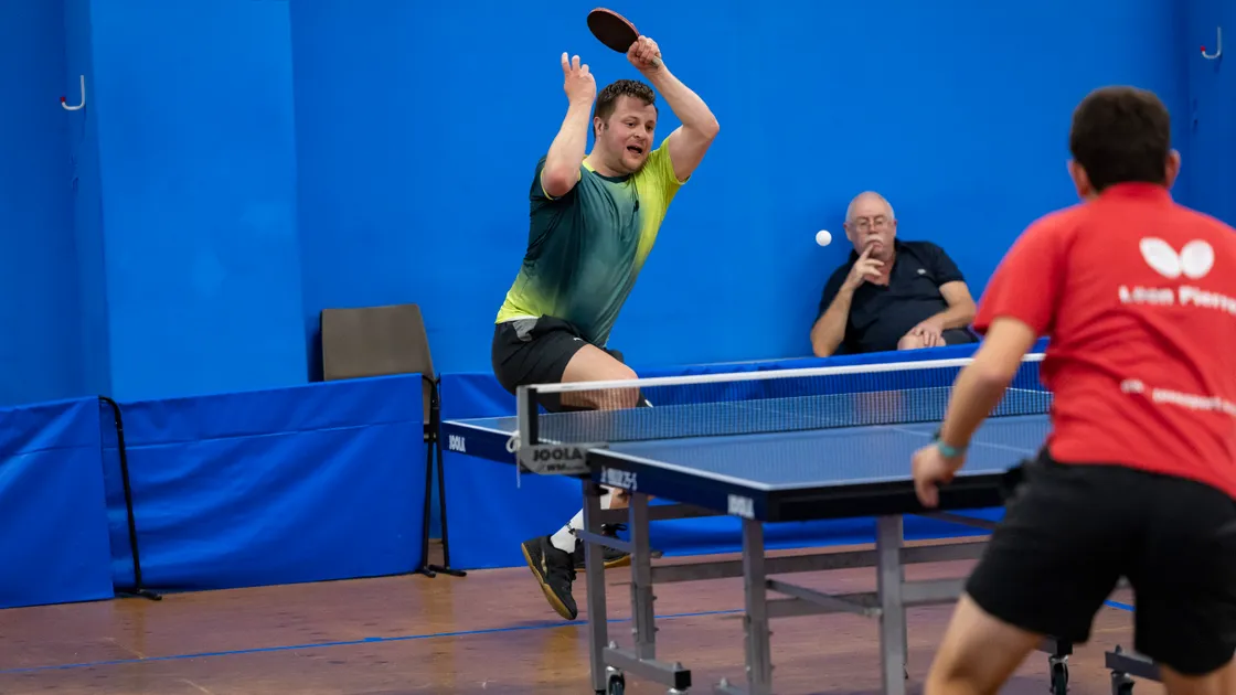 Garry Dodd hits a forehand in his CI men's singles win over Leon Pierre on Friday night.