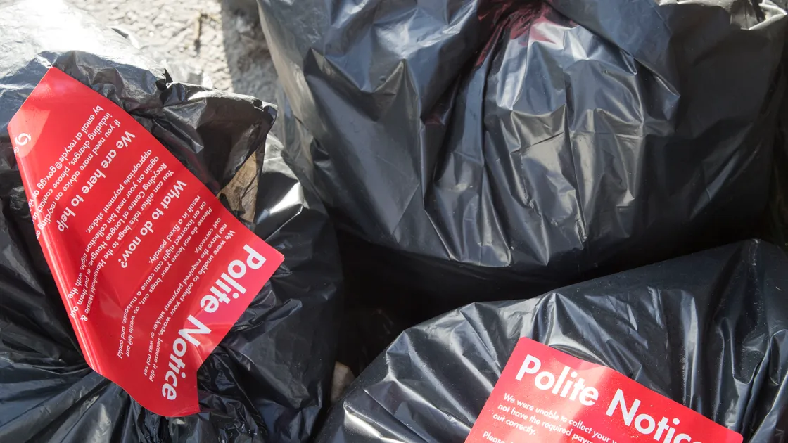 People who ignore warnings about not putting a payment sticker on their black sack could soon find the polite warning notice replaced with a fixed penalty fine. (Picture by Adrian Miller, 24398073)