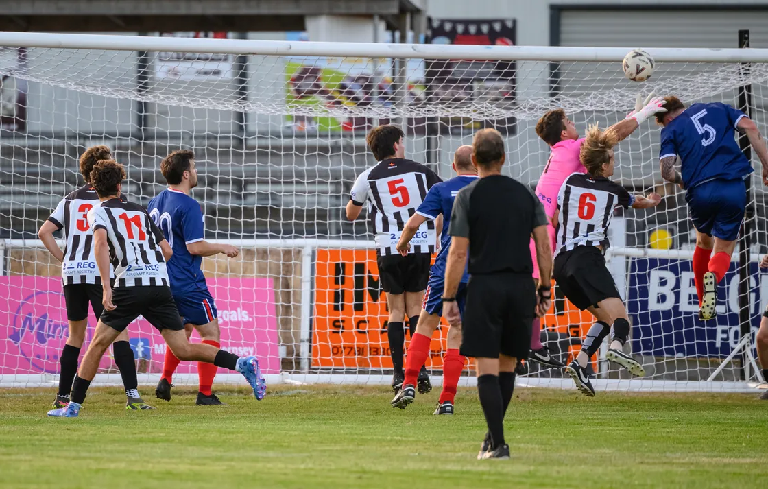  Jordan Le Poidevin rises to meet a corner, but his header flies just over the bar.