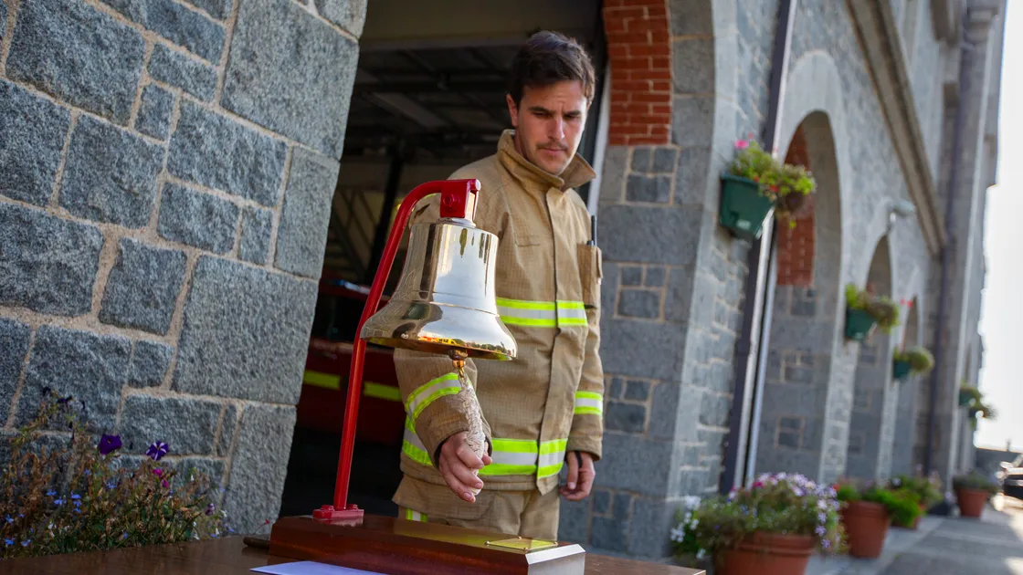Firefighter Jim Sheppard rang a bell nine times before the two-minute silence. (32514811)