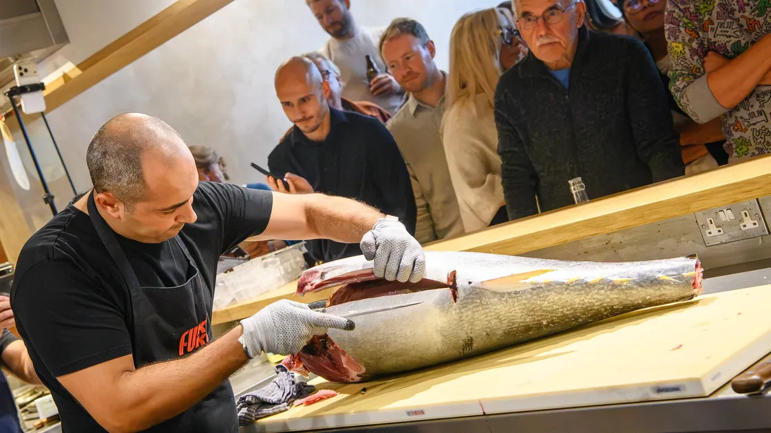 The carving of what is believed to be the first tuna caught by a team from a Channel Island restaurant. Fukku organised an open doors event at their premises in Smith Street where they offered a taste of the freshly prepared fish. 						 (Pictures supplied by Andrew Le Poidevin, 34978482)