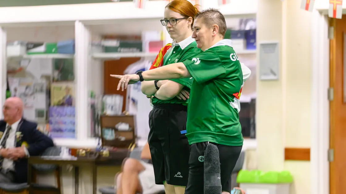 Ali Merrien points something out to her ladies’ triples teammate Catherine Bonsall