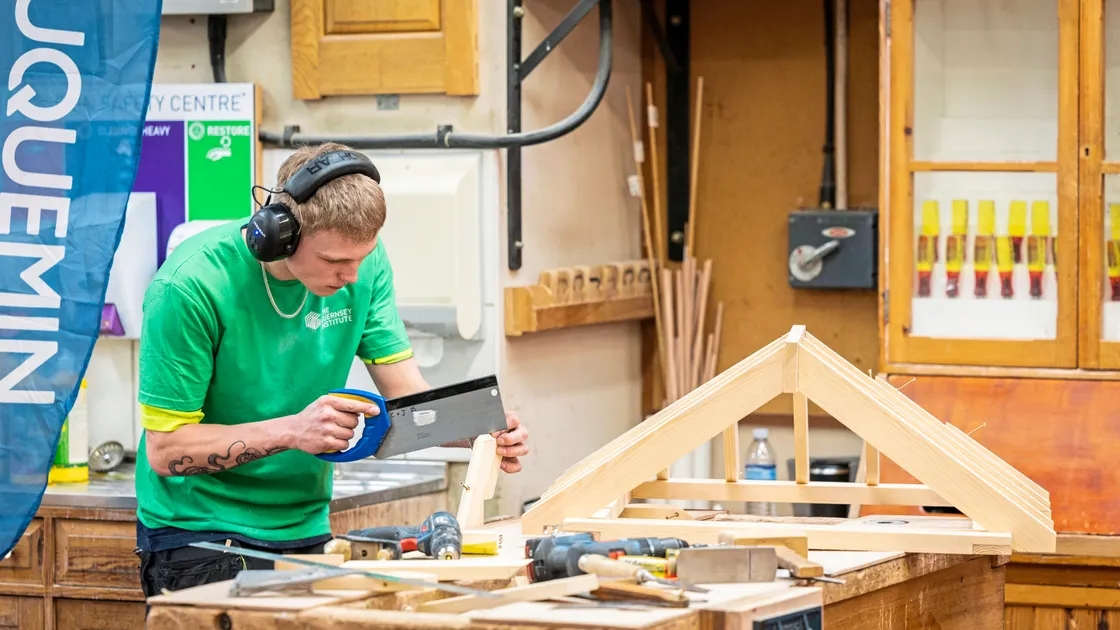 Guernsey’s Dylan Truffitt, 18, is a picture of concentration during the carpentry competition at The Guernsey Institute’s Coutanchez campus. (Picture by Sophie Rabey, 34029748)