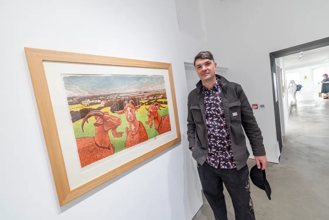 Oleg Mikhailov with one of his woodcut prints