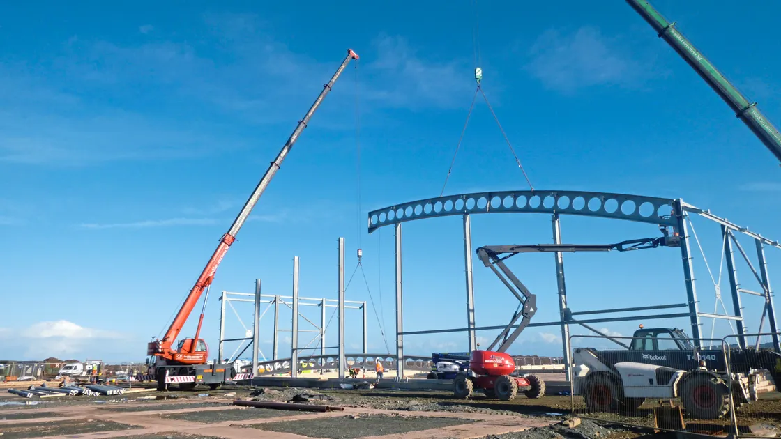 Specialist cranes lift the steelwork for the new waste management facility at Longue Hougue.