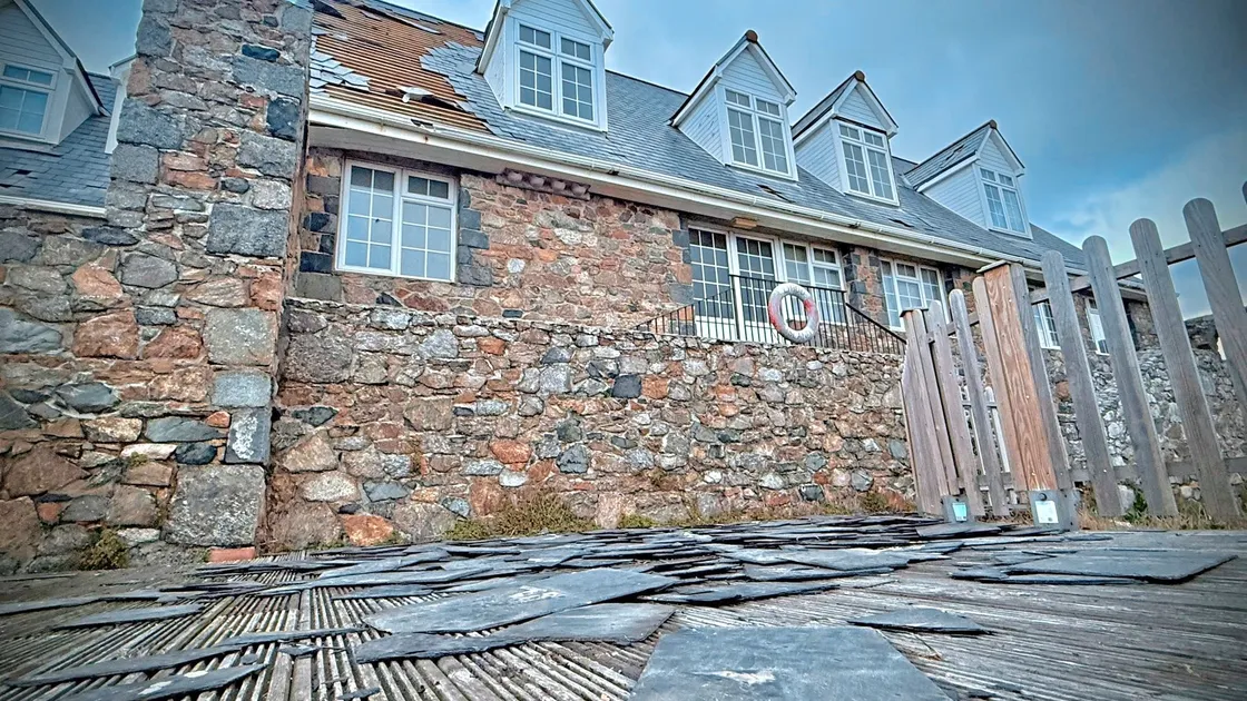 As well as damage to the back and front of the roof, tiles lost in the 80mph winds have ripped fascias boards off dormer windows, and even heavy outdoor furniture has been damaged