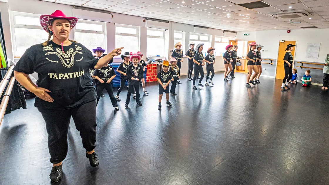 Rhianna King, left, leads the Academy of Dance & Theatre Arts in the 2025 Tapathon