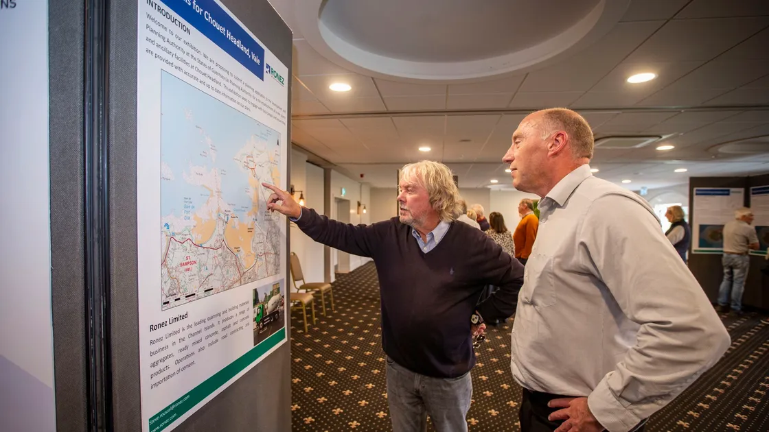 Ronez general manager Steve Roussel, right, hears the concerns of Nick Trott at the company's drop-in session yesterday outlining its plans for quarrying at Chouet headland. (Picture by Sophie Rabey, 30105803)