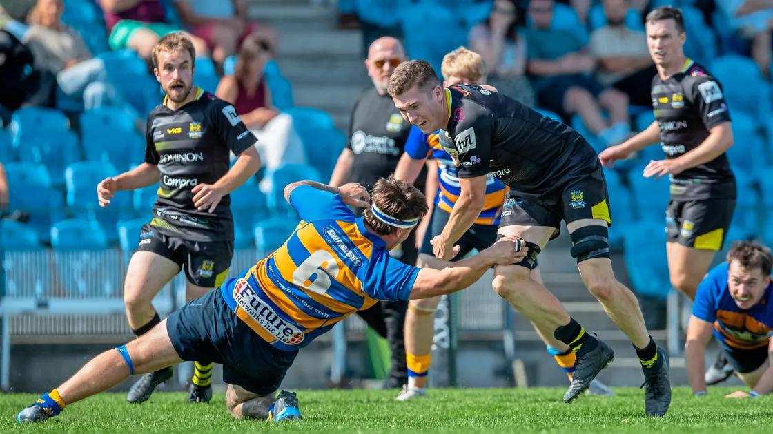 Luke Grigg runs into a tackle at Footes Lane