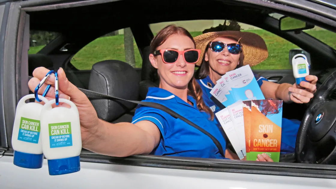 Community nurses Kath Innes, left, and Heather Kennedy with key ring-style sun-cream bottles from cancer awareness charity Male Uprising Guernsey which they have been handing out around the island to make people aware of the dangers of skin cancers. (Picture By Steve Sarre, 19195226)