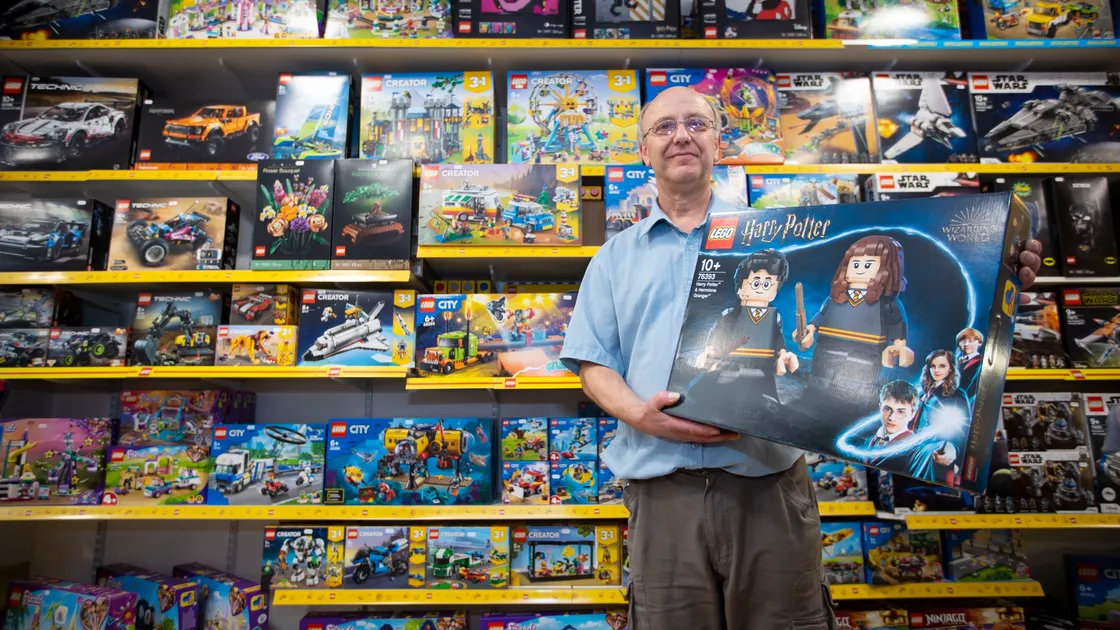 Steven Cocks the manager/owner of The Model Shop and Dice Gifts. with a Harry Potter Lego set. (30306224)