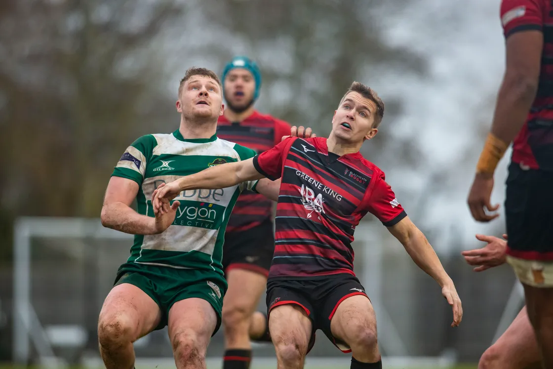 Guernsey centre Tom Teasdale, left, jostles for position as the players wait for a box kick to come down. (31817825)