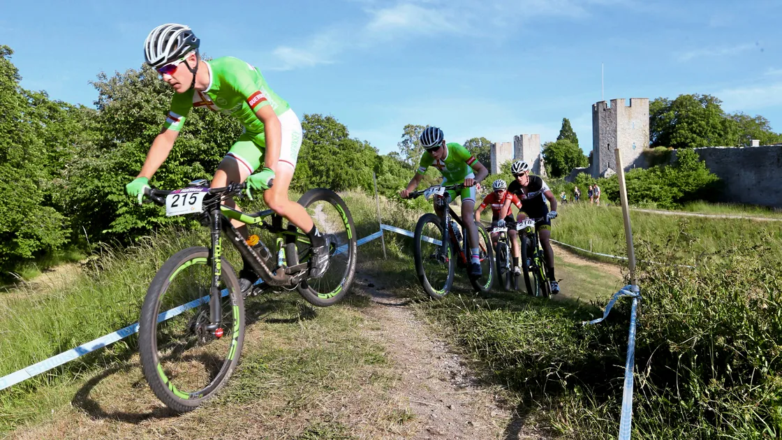 Guernsey’s mountain bikers on the course in 2017, with Visby’s medieval fortifications providing a dramatic backdrop.
