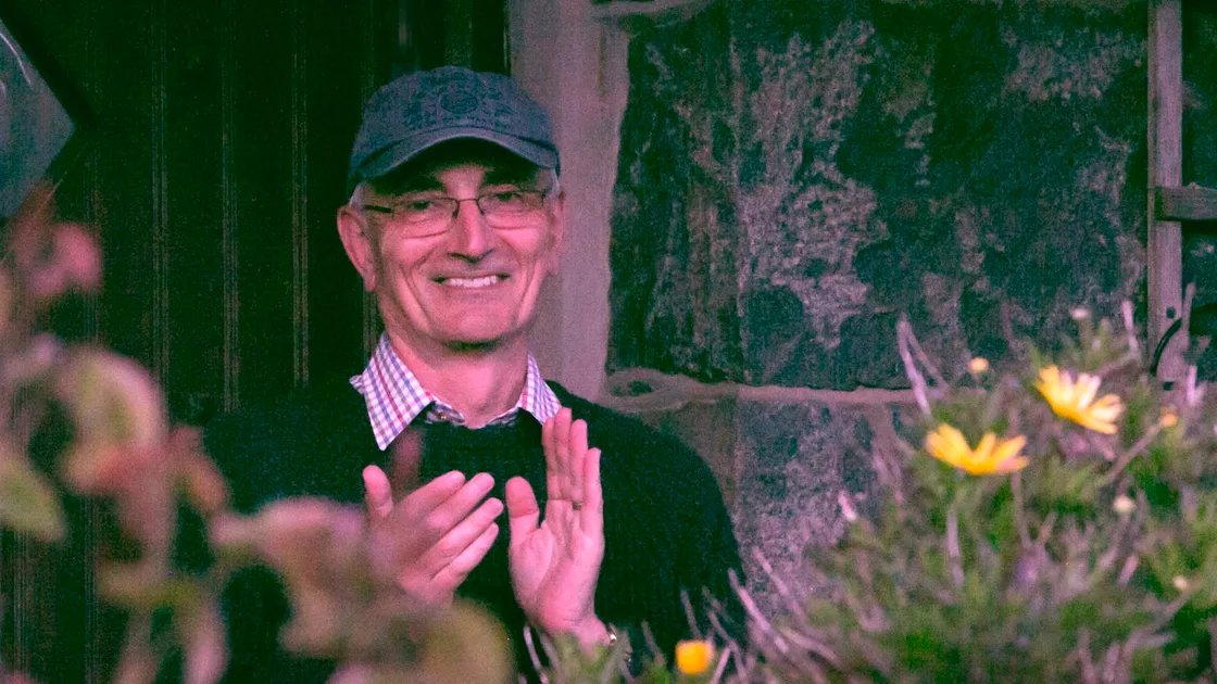  John Ogier clapping outside his home in St Martin's for nurses, doctors, carers, health workers, key workers. Picture by Adrian Miller 16-04-20 (28036063)
