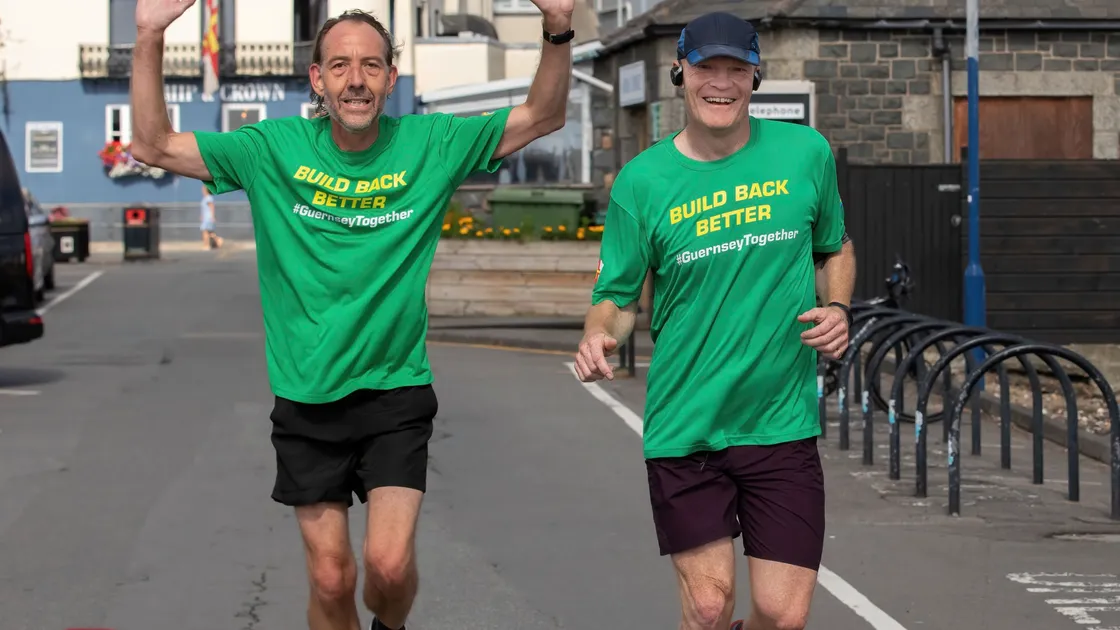 Steve Falla and Chief Minister Gavin St Pier taking part in the Butterfield Father’s Day Half Marathon in June. (Picture by Chris George)