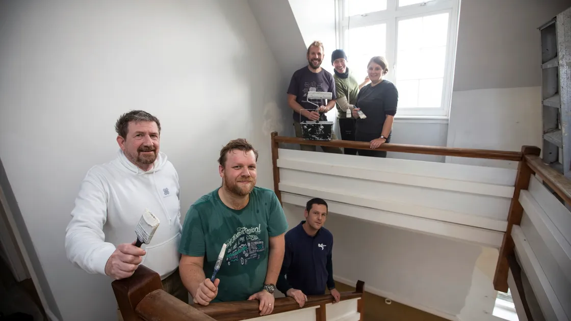 Staff from Healthspan have been helping to paint the house on Lihou. Left to right are Jim Kelly, Tim Lee-Priore, Lihou warden Steve Sarre, Simon Sole, Tim Johns and Rachel Davies. (Picture by Peter Frankland, 26489095)