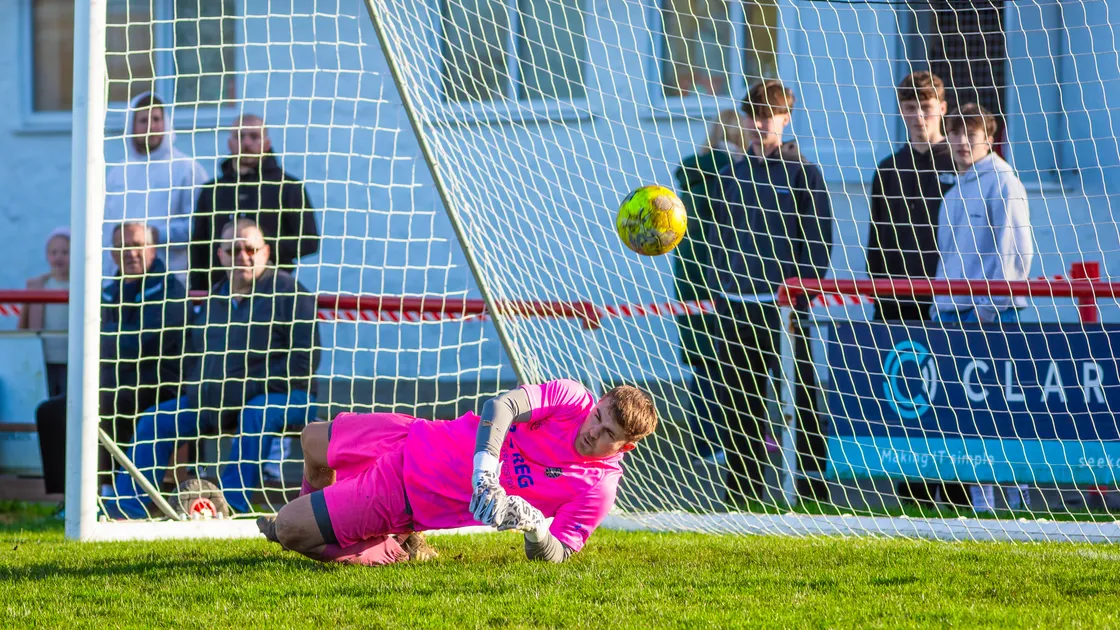 St Martin’s goalkeeper Seb Sheppard makes an excellent save to keep out Simon Arnold’s deflected free-kick and maintain his side’s 2-1 lead over Sylvans on Saturday at St Peter’s
