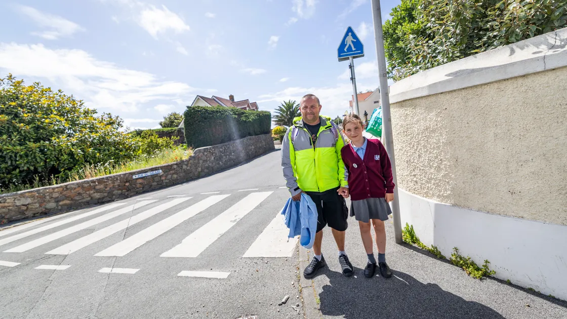 James Le Messurier with his daughter Aimee, 9. Traffic & Highway Services is testing out a new ‘School Street’ for La Mare de Carteret Primary School and the Sixth Form Centre. The School Street area will run through Rue des Francais and the eastern section of Rue du Galaad. (Pictures by Sophie Rabey, 34779392)