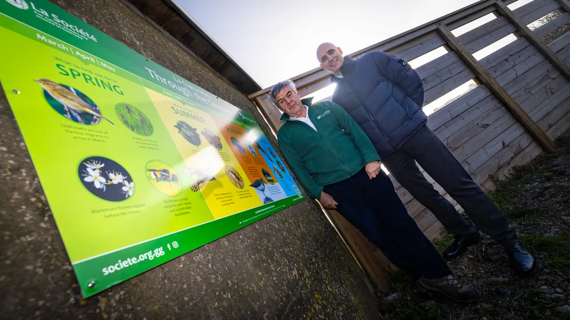 President of La Societe Guernesiaise Trevor Bourgaize, left, and Aladdin’s Cave joint managing director Jason Mahy with a new interpretation board for children at the La Claire Mare nature reserve. The board has been paid for in lieu of carrier bag sales at Aladdin’s Cave