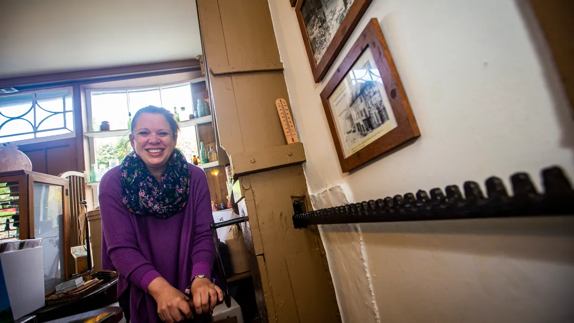 Shop manager Caro Drake winding the barrel shutters at The National Trust Victorian Shop in Cornet Street which is opening for the summer season. (Picture by Peter Frankland, 31947692)