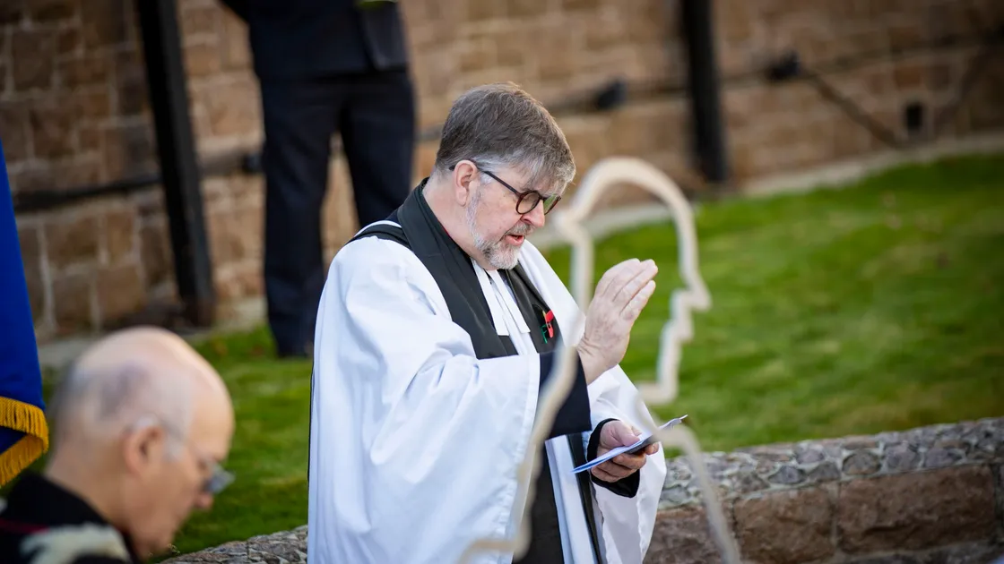 The Dean of Guernsey, the Very Rev. Tim Barker, giving the blessing at yesterday’s ceremony at the war memorial in St Martin’s. (Picture by Sophie Rabey, 30187596)
