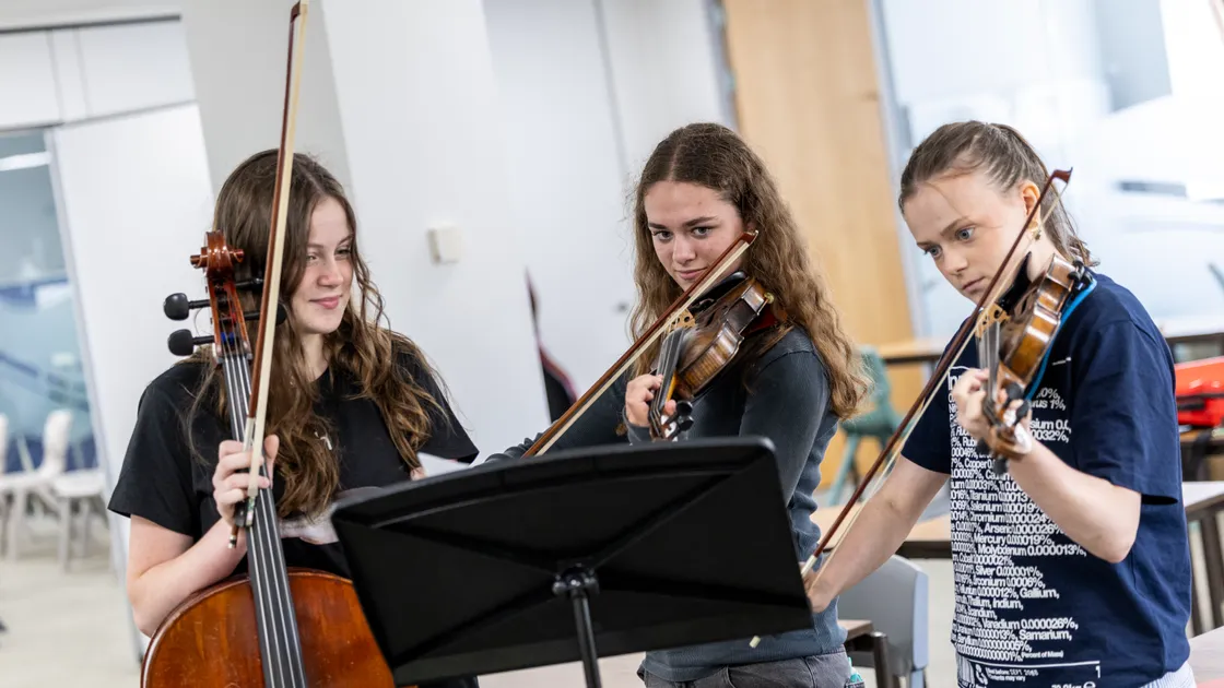 Left to right: Flossie Glynn-Riley, Charlotte Herschel and Beattie Glyn-Riley were among the musicians taking part in the week-long Elizabeth College Summer Orchestral Course.