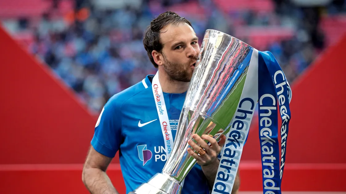 Jersey’s Brett Pitman won the Checkatrade Trophy at Wembley while with Portsmouth during his successful professional career. He now plays for Midhurst & Easebourne, who face Guernsey FC at Victoria Park this afternoon.