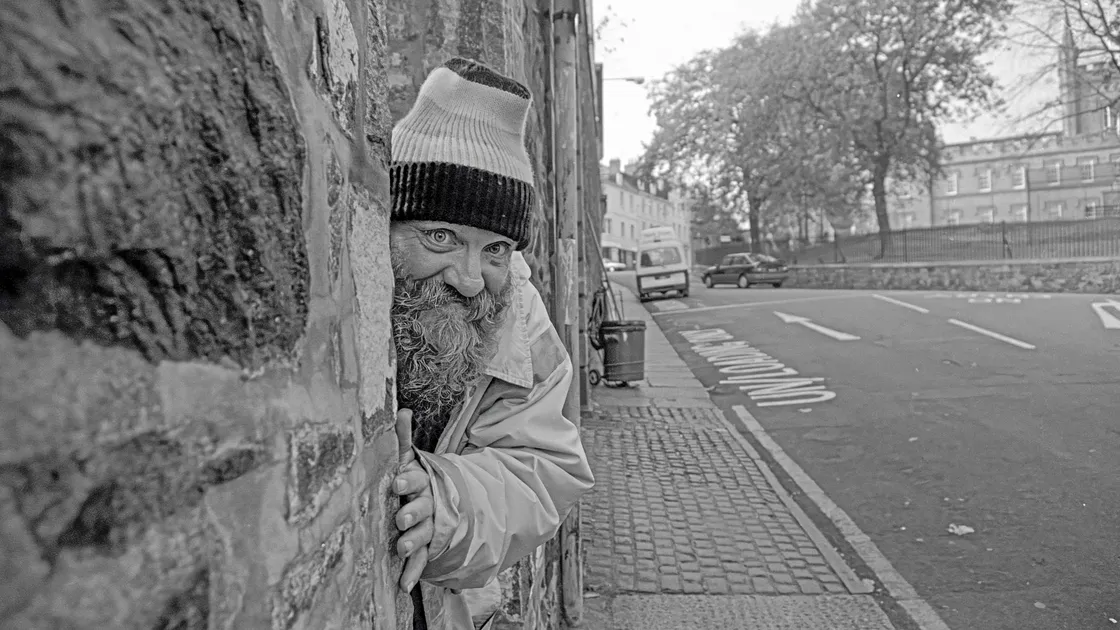Peter Legg, AKA ‘Pete The Sweep’, waits outside St James for his wages to be delivered in October 1993