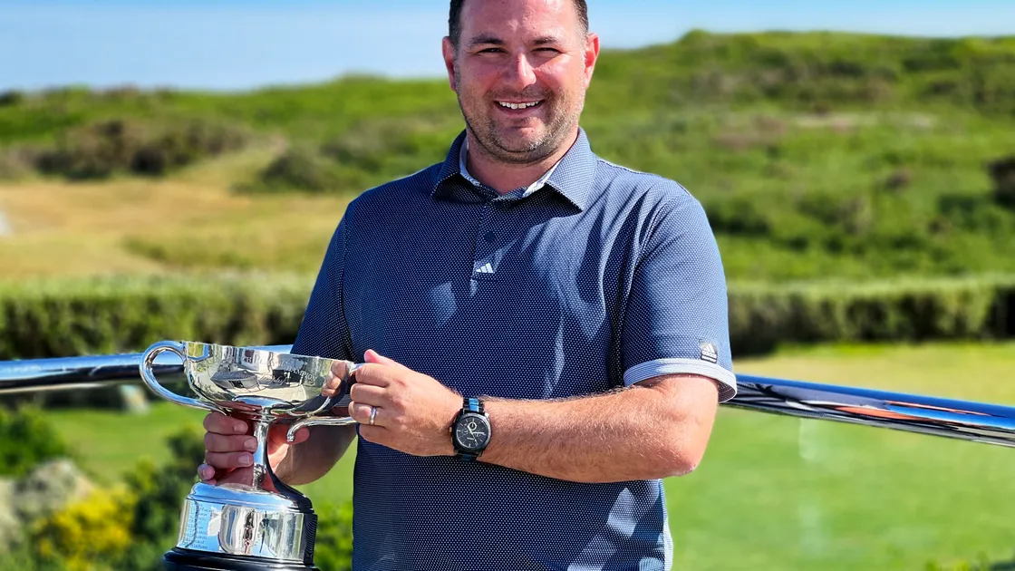 Jamie Blondel proudly holds the Bachmann Trophy having won the Men's Island Golf Championship for a second time..Picture by Tony Curr, 29-05-22. (30875696)