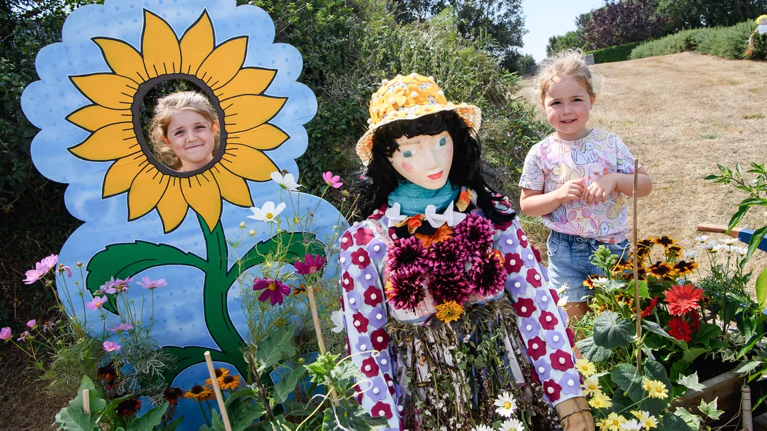 The 23rd Annual Torteval Scarecrow Festival attracted thousands of visitors to the lanes around the parish church. Orla and Mia Robert, 5 and 3, jumped at the chance to feature in this floral display on their way around the whole trail.