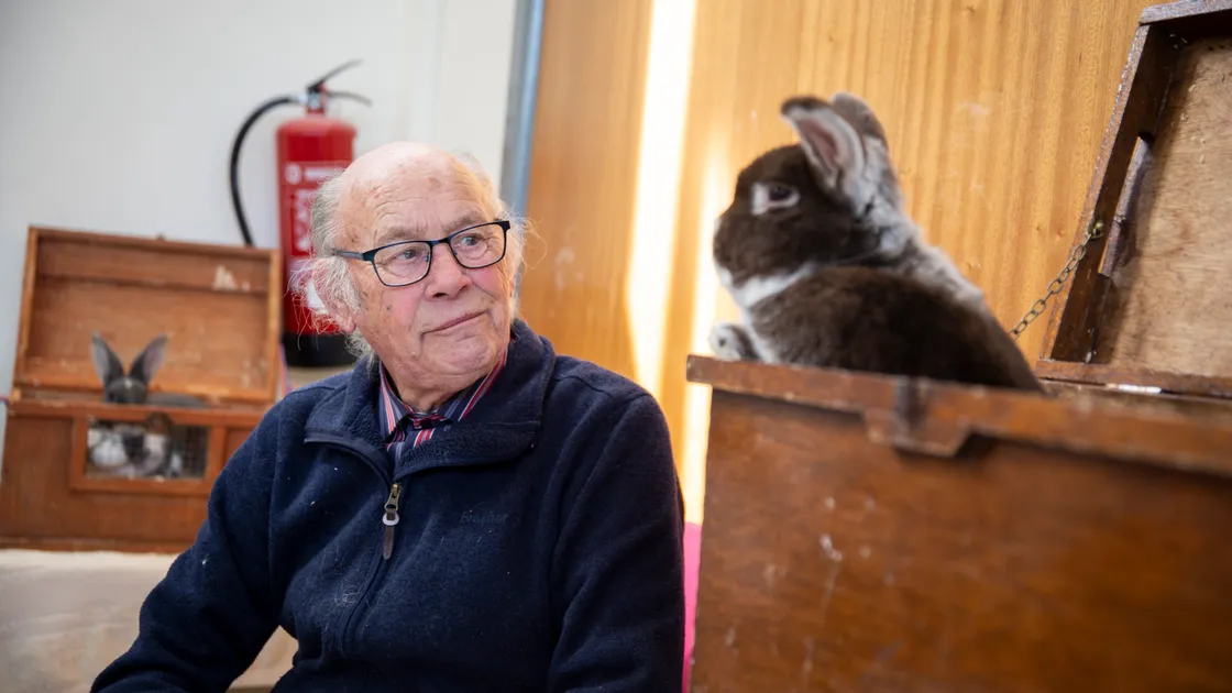 Alf Symphorien with one of his rabbits, Bart