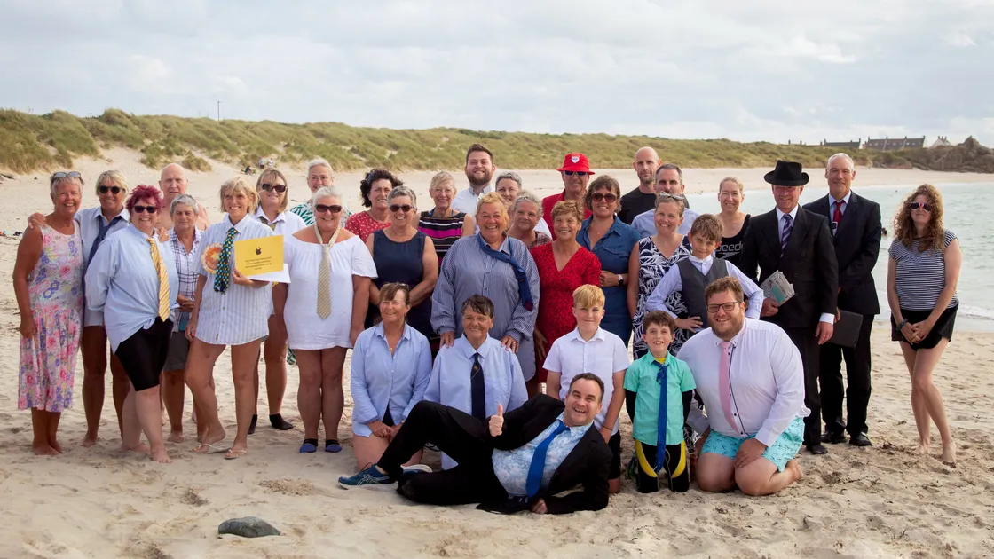 The Port Soifice charity fundraiser saw everyone dress up in office attire and jump into the sea to raise money for Guernsey Chest & Heart. (Picture by Erin Vaudin, 33440271)
