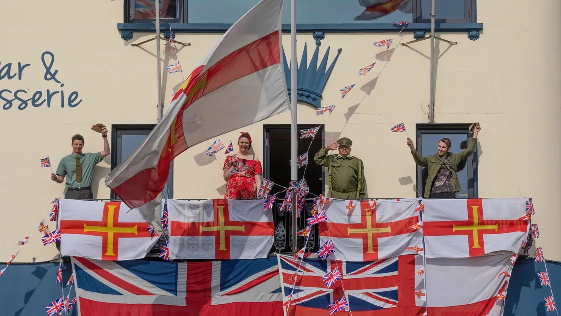 Staff at the Ship and Crown on the balcony of the pub on Liberation Day wearing traditional military and 1940s dress, making sure to adhere to social distancing guidelines. Left to right, George McPhee, Alisha Thomas, landlord Pat Anslow and Ryan Heaume. (28249761)
