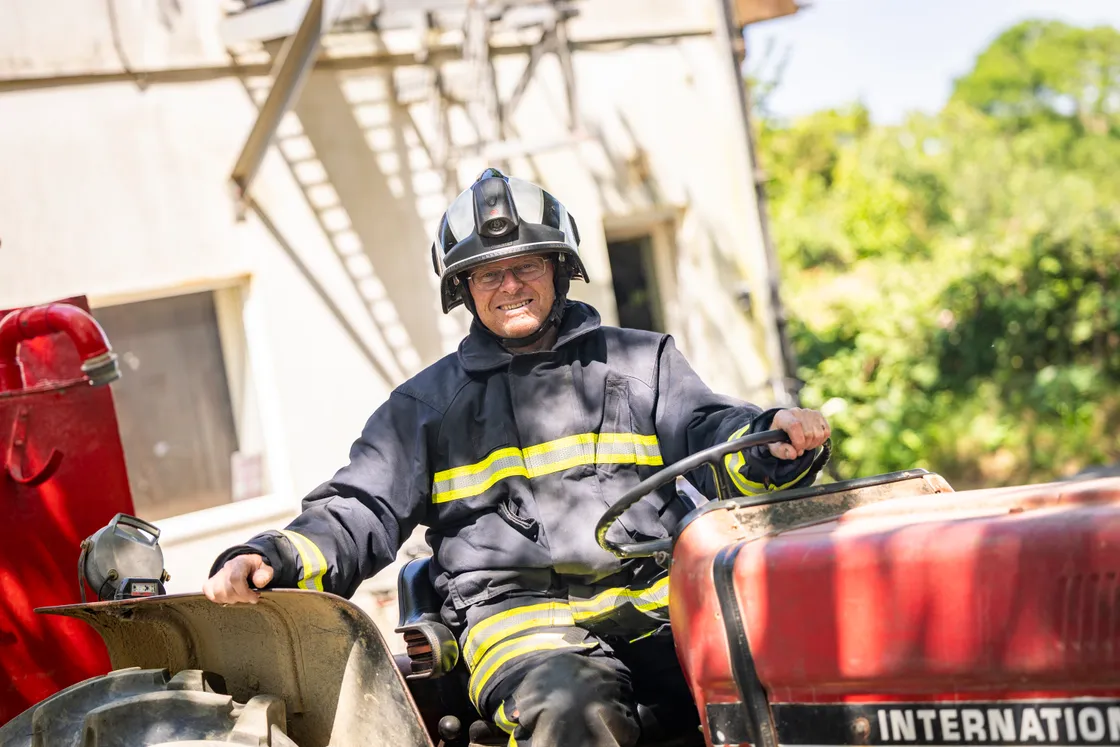 Fire chief Kevin Adams fully kitted out on the tractor