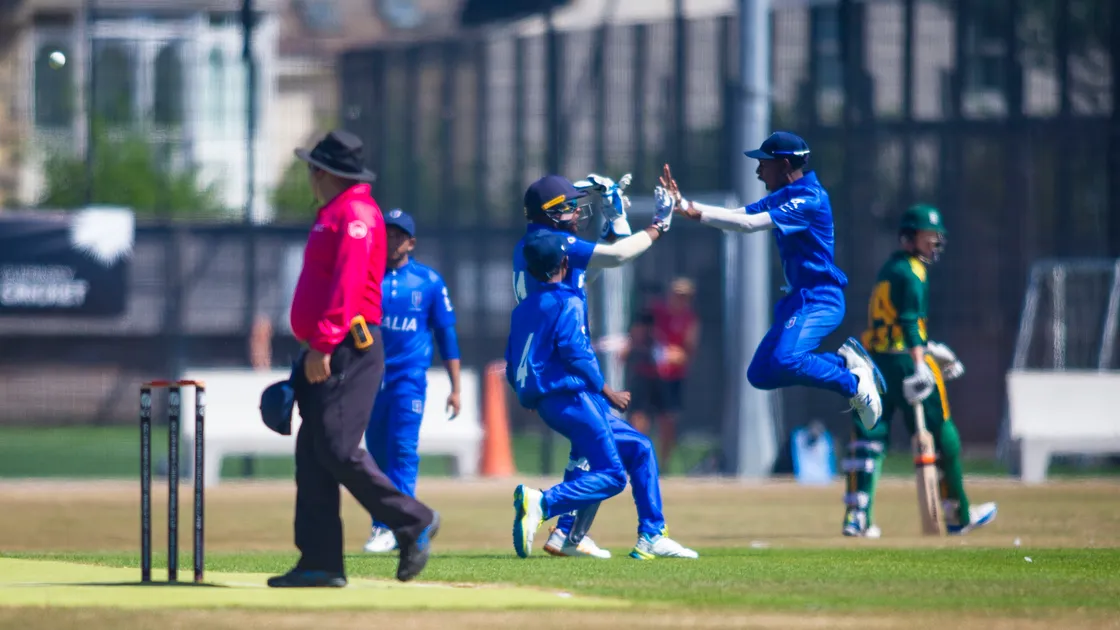 Italy celebrate the big wicket of Guernsey captain Ollie Clapham at the KGV. (Picture by Peter Frankland, 31138818)