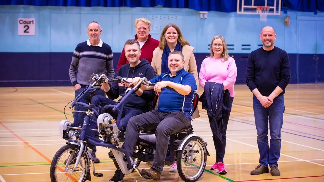 Back, left to right, Ian Brown, Stuart Perfitt from Only Fools and Donkeys, charity rider Natalie Davidson, Penny Smart, and Giovanni Vullo of Vanraam Cycles which builds the bikes. On the machine, which is being donated to the Autism Hub, are charity rider Matt Collas and Only Fools and Donkeys co-founder Ray Smart. (Picture by Peter Frankland, 32036655)