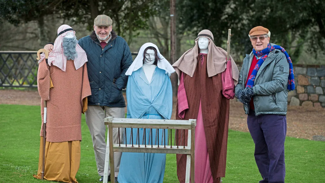 Tony Falla, left, and Roy Sarre with the nativity scene, which was vandalised when in the centre of St Peter Port last year but which is now situated near St Peter’s Church.(Picture by Adrian Miller, 23443178)