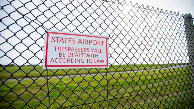 Man accused of twice scaling airport fence denies charges