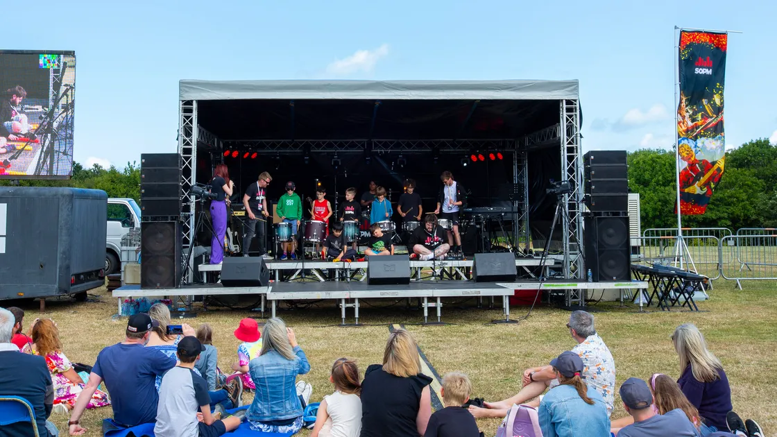 Young drummers from the School of Popular Music were among those to take to the stage for its 10th anniversary party in the park at Delancey on Saturday. (Picture by Karl Dorfner, 33397374)