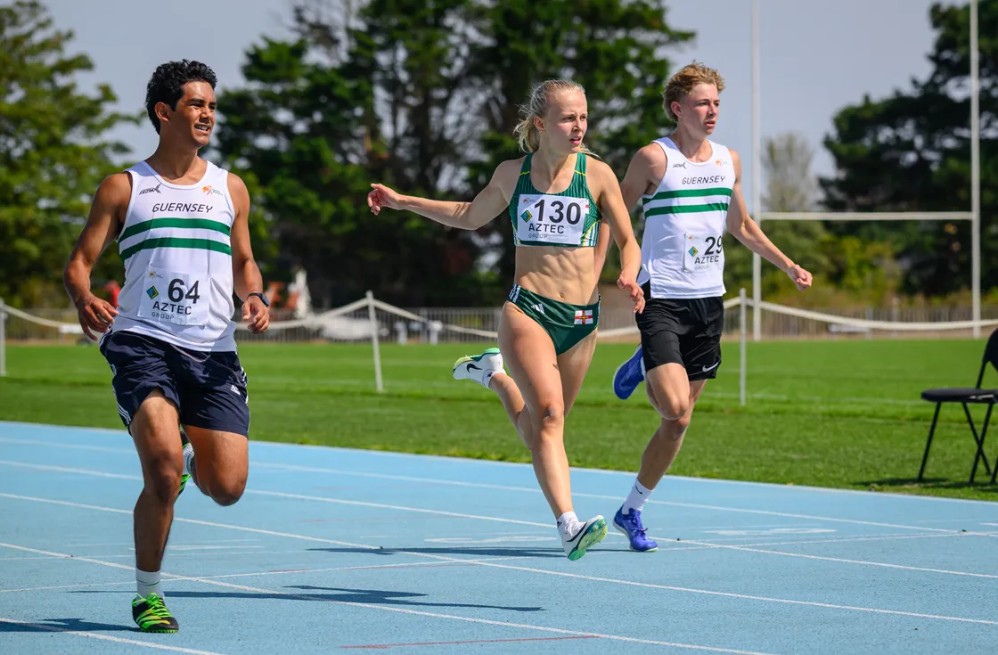 Jake Taylor (64) finishes just ahead of Commonwealth Games sprinter Abi Galpin in the 100m with Tom Holt in third.
