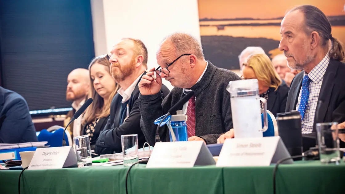 Deputy Neil Inder (centre) faces the Scrutiny panel yesterday at the Castel Douzaine Room. (Picture by Peter Frankland, 33855235)
