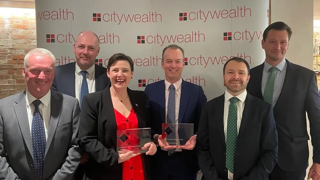 Investec Bank (Channel Islands) CEO Brendan Stewart, and Jane Niles hold its awards from the night. 