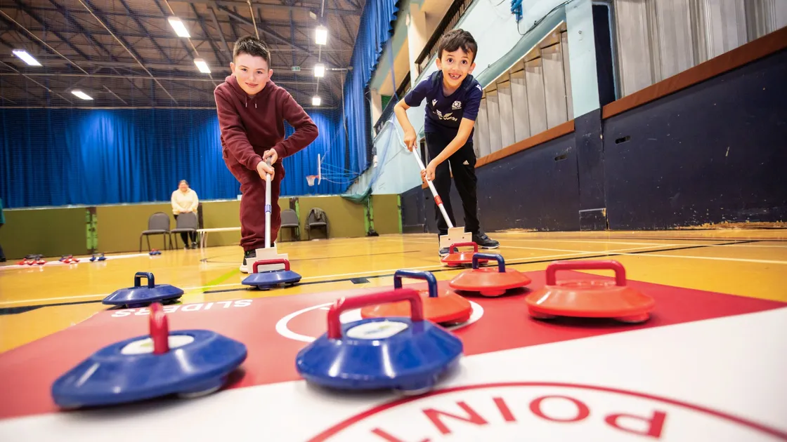 Blair Niven, 7, left and Cory Dyke, 10, playing kurling at Beau Sejour. (Picture by Sophie Rabey, 32986972)
